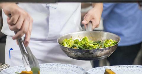 A person cooking broccoli in a pan. (Representative Cover Image Source: Pexels | Nick Souza)