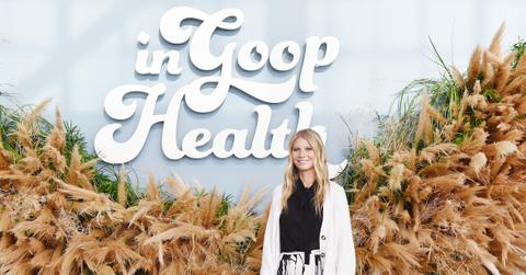 Gwyneth Paltrow in front of goop backdrop