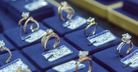 A view of seven diamond rings on display, for sale at a trade fair for synthetic diamonds in Zhengzhou in central China's Henan province.