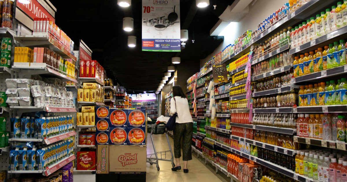 Woman shopping groceries in a retail supermarket (Representative Cover Image Source: Pexels | Hobi Industri)