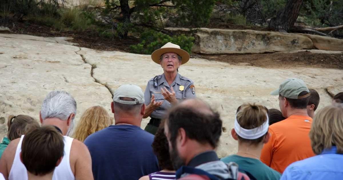A park ranger speaks to a tour group at a national park. (Representative Cover Image Source: Getty Images | Wilsilver77)