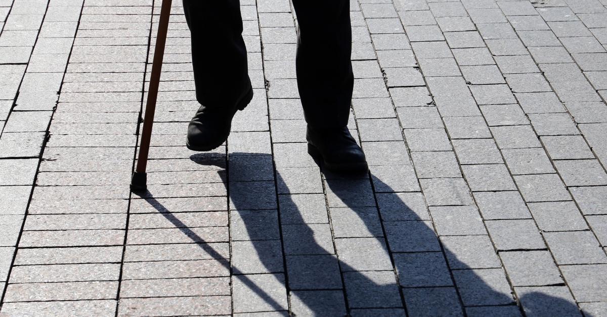 Person using a cane to walk