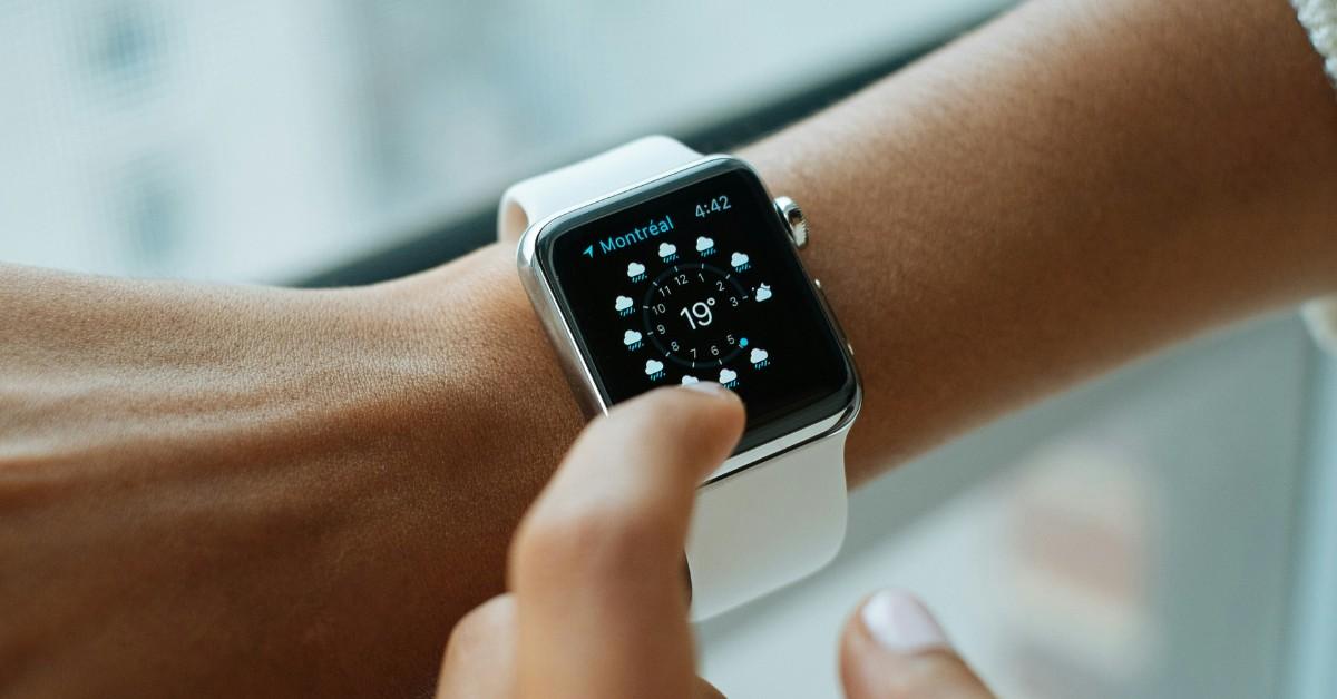 A person checks the weather on their Apple Watch