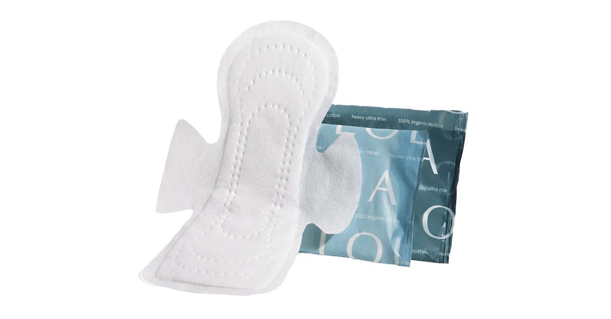 Lola organic pad with wings next to packaging