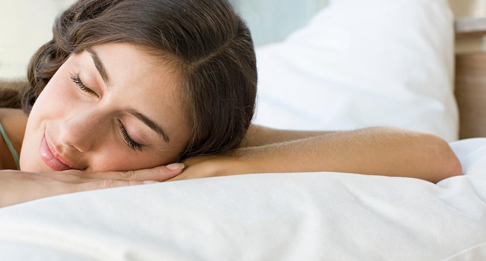 A woman resting on a pillow