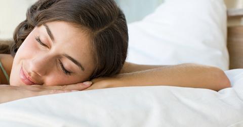 A woman resting on a pillow