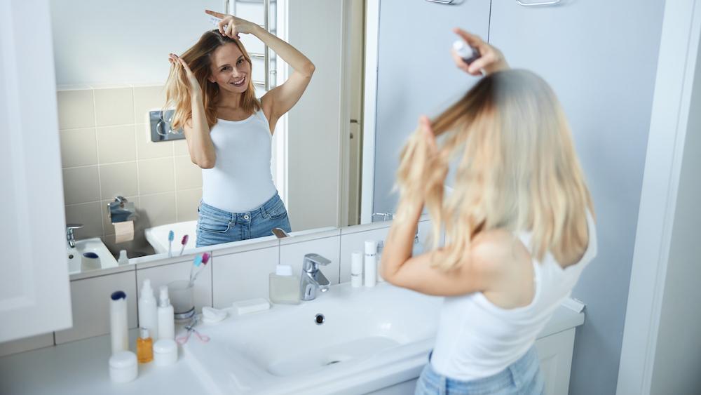 Woman Spraying Hair