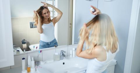 Woman Spraying Hair