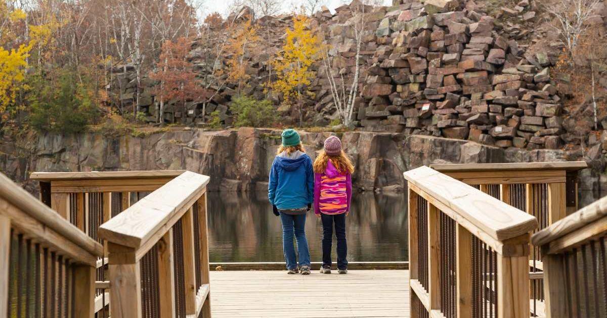 Visitors walking on a boardwalk in a state park in Minnesota (Representative Cover Image Source: Getty Images | Emholic)