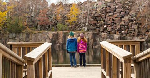 Visitors walking on a boardwalk in a state park in Minnesota (Representative Cover Image Source: Getty Images | Emholic)