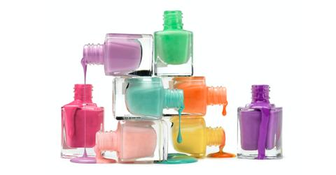 Nail polishes stacked on top of each other.