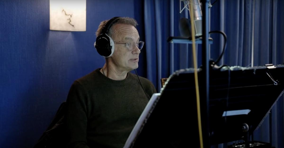 Tom Hanks in a blue recording booth to narrate 'The Americas' docuseries. 