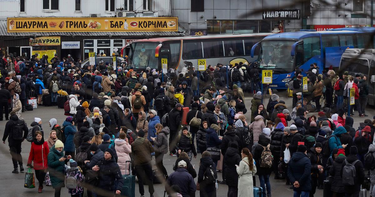 People wait for buses at a bus station as they attempt to evacuate the city on Feb. 24, 2022 in Kyiv, Ukraine.