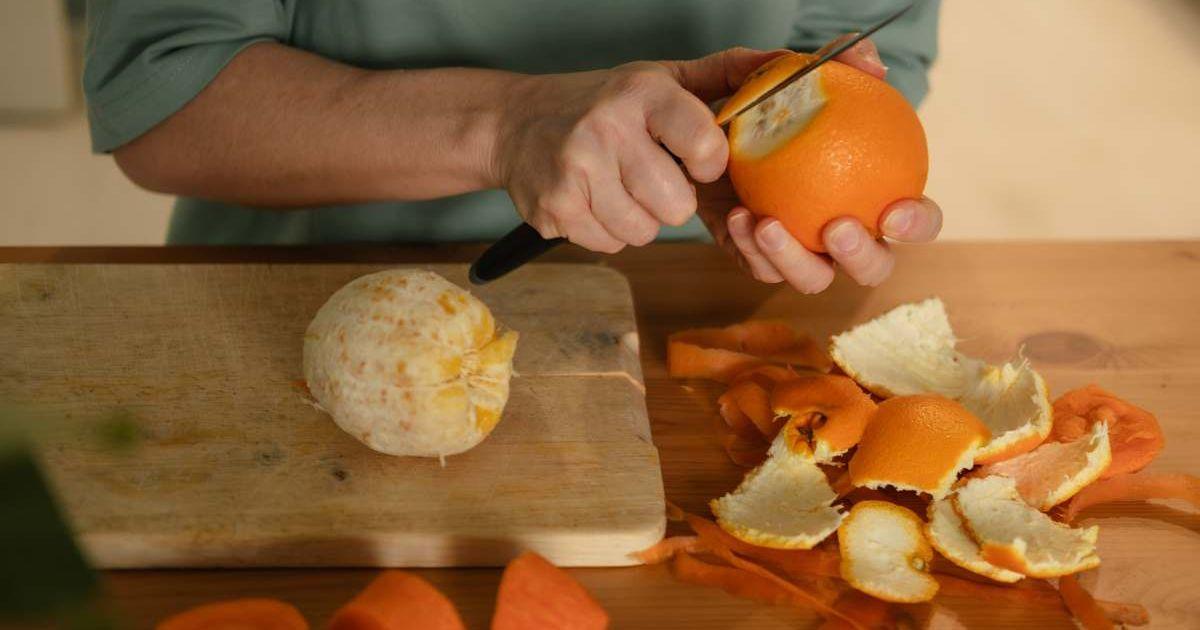 A woman peeling an orange (Representative Cover Image Source: Getty Images | Ekaterina Vasileva-Bagler)