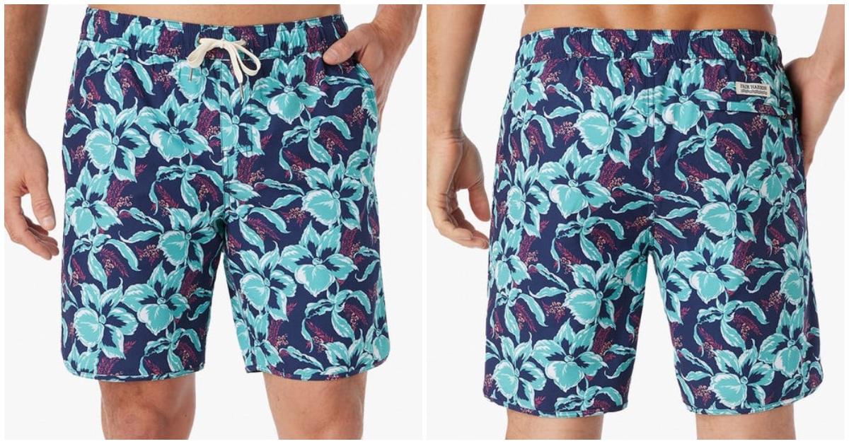 Pair of men's swim trunks in blue and purple flower pattern. 