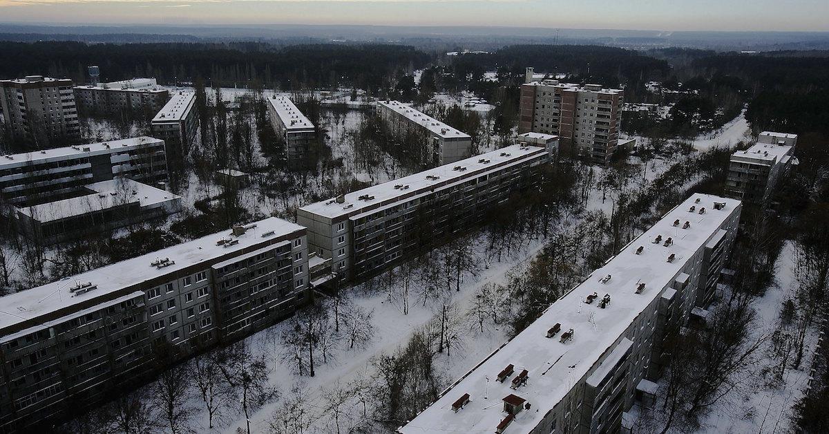 Snow-topped buildings in a city, shot from above 