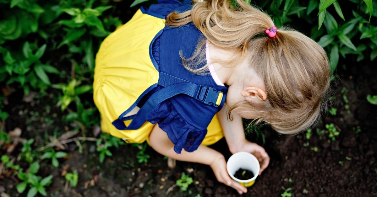 Preschooler playing in the dirt