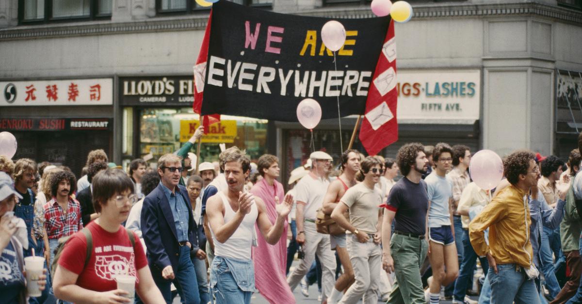 A crowd marches during a Pride protest