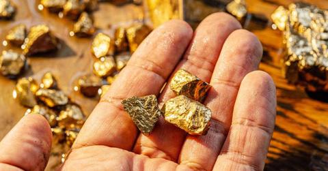 A person holding nuggets of gold. (Representative Cover Image Source: Getty Images | ValentynVolkov)