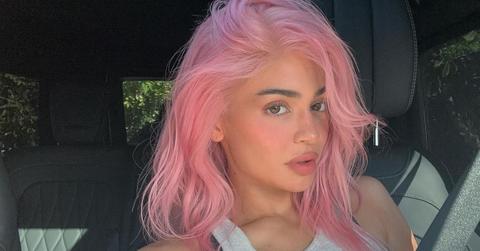 Selfie of Kylie Jenner sitting inside a car with pink hair