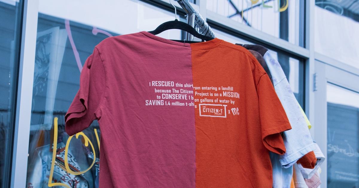 On a hanger is an upcycled Citizen-T shirt made from two red T-shirts.