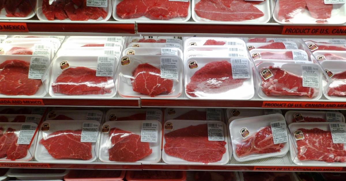 A variety of different packaged meats on display at the grocery store