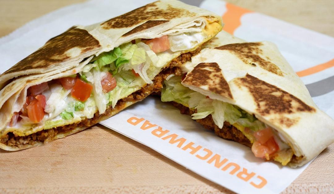 A close-up of the Taco Bell Crunchwrap on a napkin 