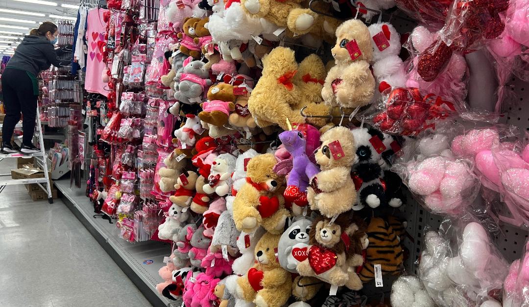 A worker stocks shelves with Valentine's Day-themed items for the upcoming holiday in Toronto, Ontario, Canada