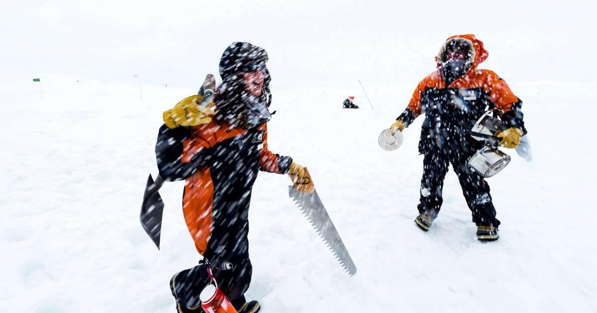 Explorers caught in a snowstorm in a remote Antarctic location. (Representative Cover Image Source: Getty Images | Jason Edwards)