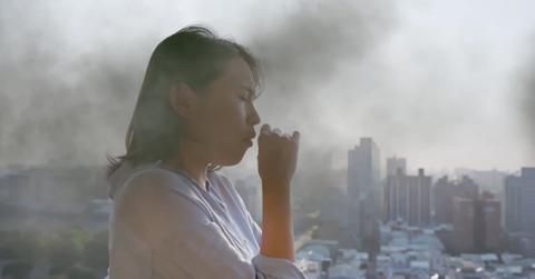 Woman covering her nose against air pollution. (Representative Cover Image Source: Getty Images | PonyWang)