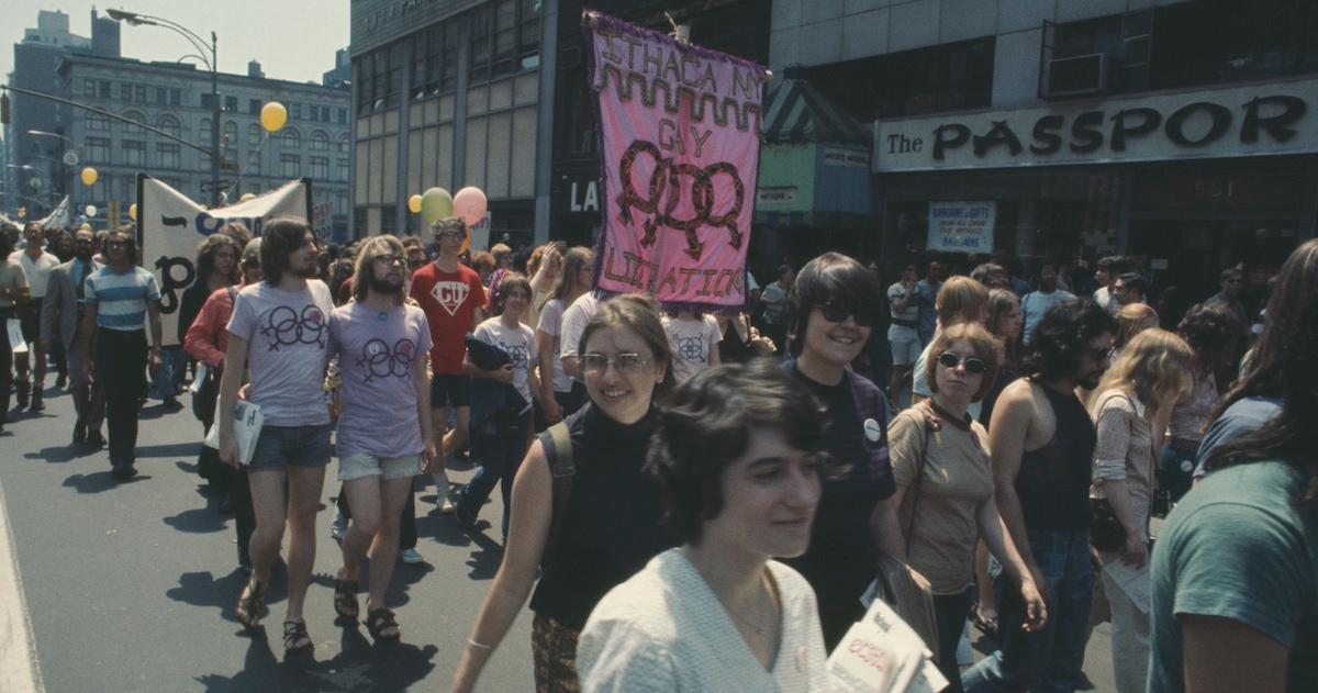 A crowd marches during a Pride protest