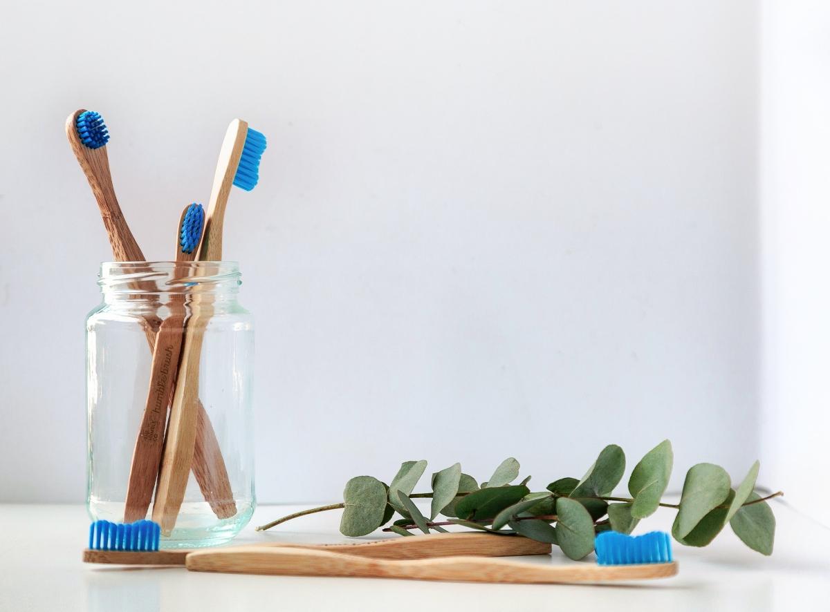 eco-friendly toothbrushes in a jar