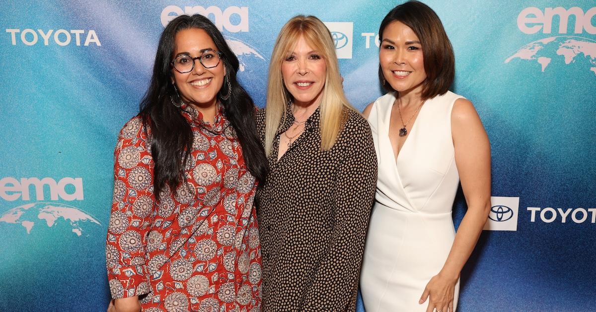 (L-R) Nisha Anand, EMA CEO Debbie Levin, and Melissa Jun Rowley pose in front of blue backdrop at the EMA IMPACT Summit.