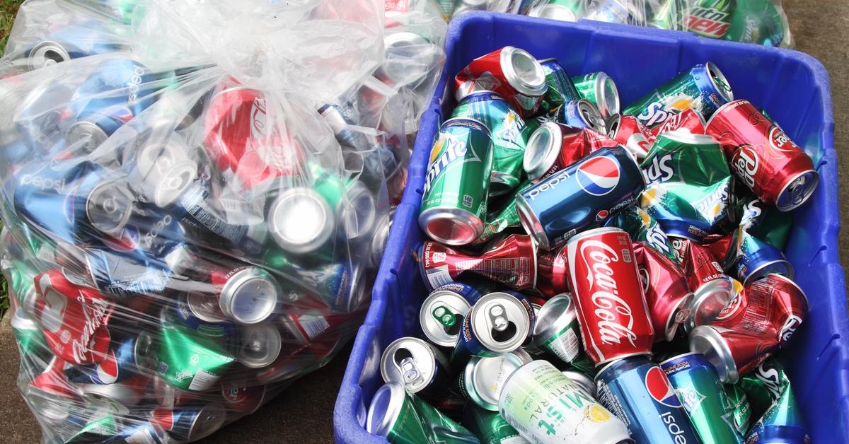 Cans of soda being recycled.