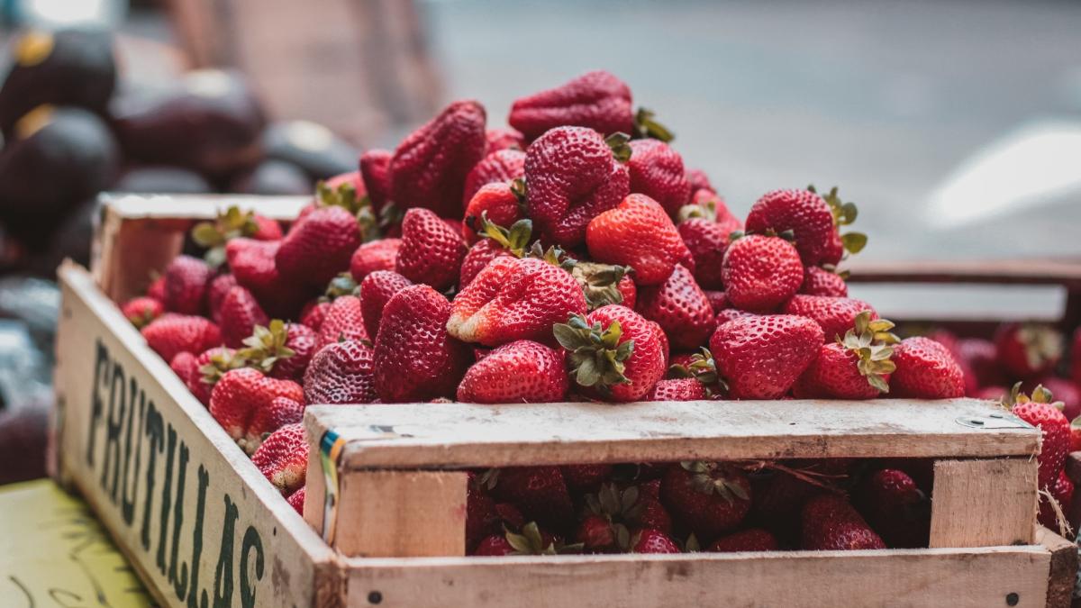 crate of fresh whole strawberries