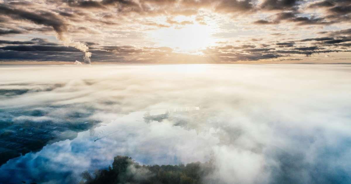 A dense layer of smoke in the atmosphere engulfs a city. (Representative Cover Image Source: Pexels | Aleksejs Bergmanis)