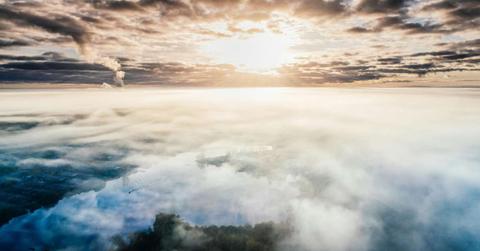 A dense layer of smoke in the atmosphere engulfs a city. (Representative Cover Image Source: Pexels | Aleksejs Bergmanis)