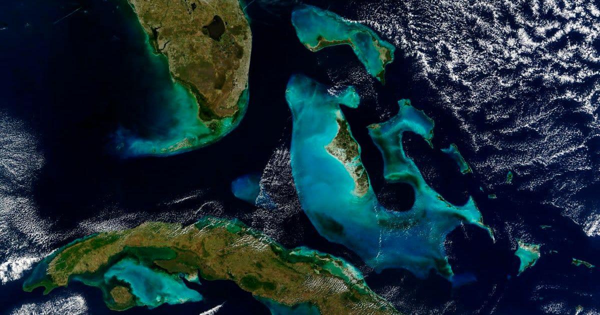 The Great Bahama Bank and Little Bahama Bank are a brilliant blue in contrast to the black of the surrounding ocean. (Cover Image Source: Getty Images | Stocktrek Images)