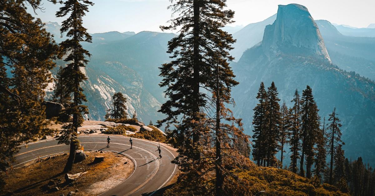 People walk around the road at Yosemite National Park
