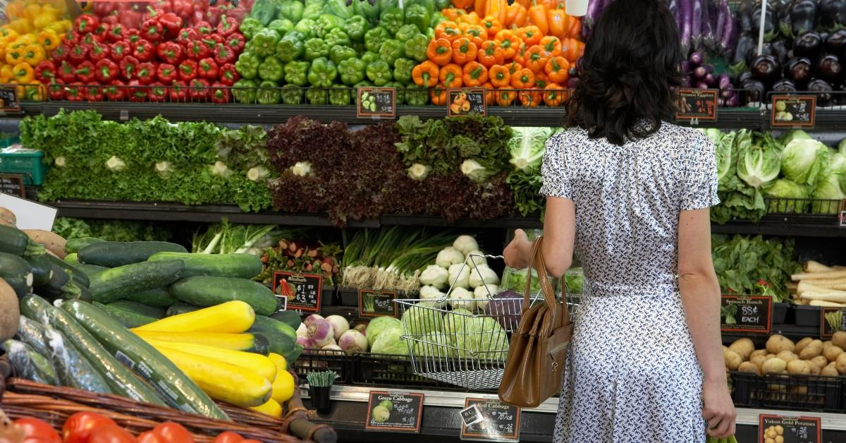 Woman shopping in the produce department. 