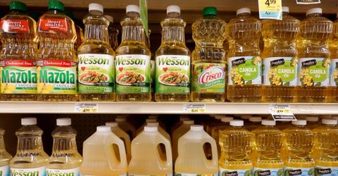 Bottles of canola oil on store shelf