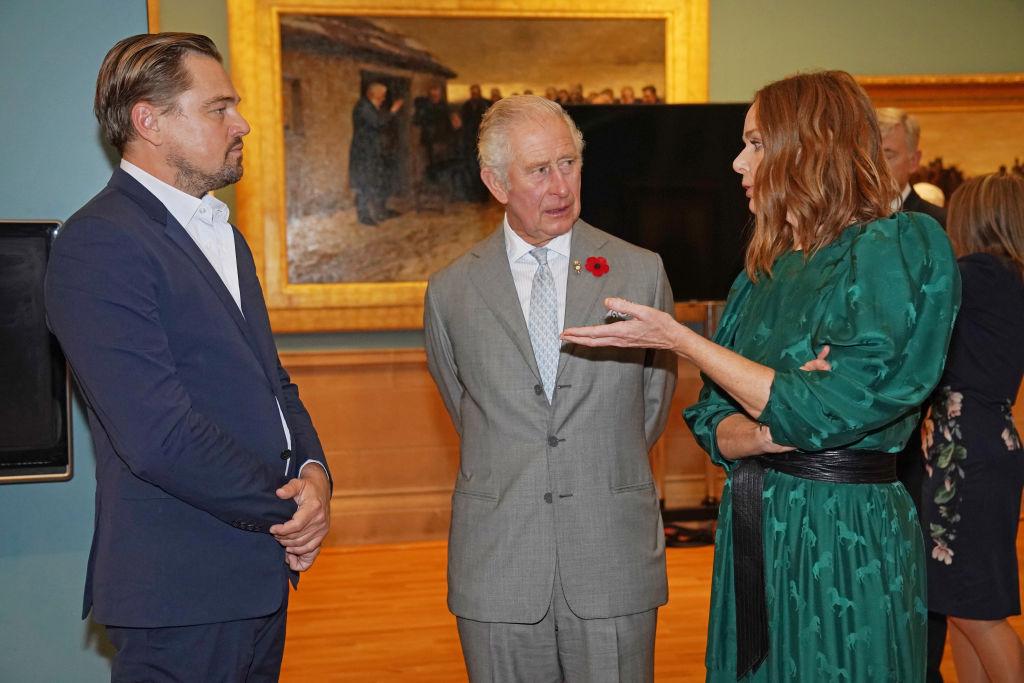 King Charles III speaks with activists and celebrities Leonardo DiCaprio and Stella McCartney, during COP26 in 2021