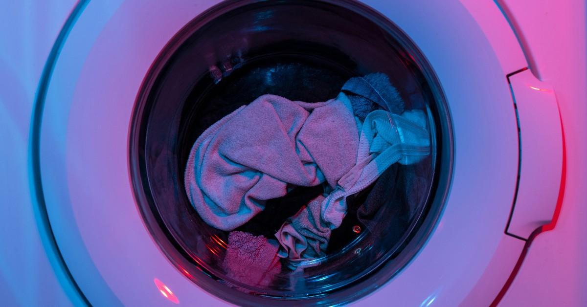 A front load washing machine full of clothes