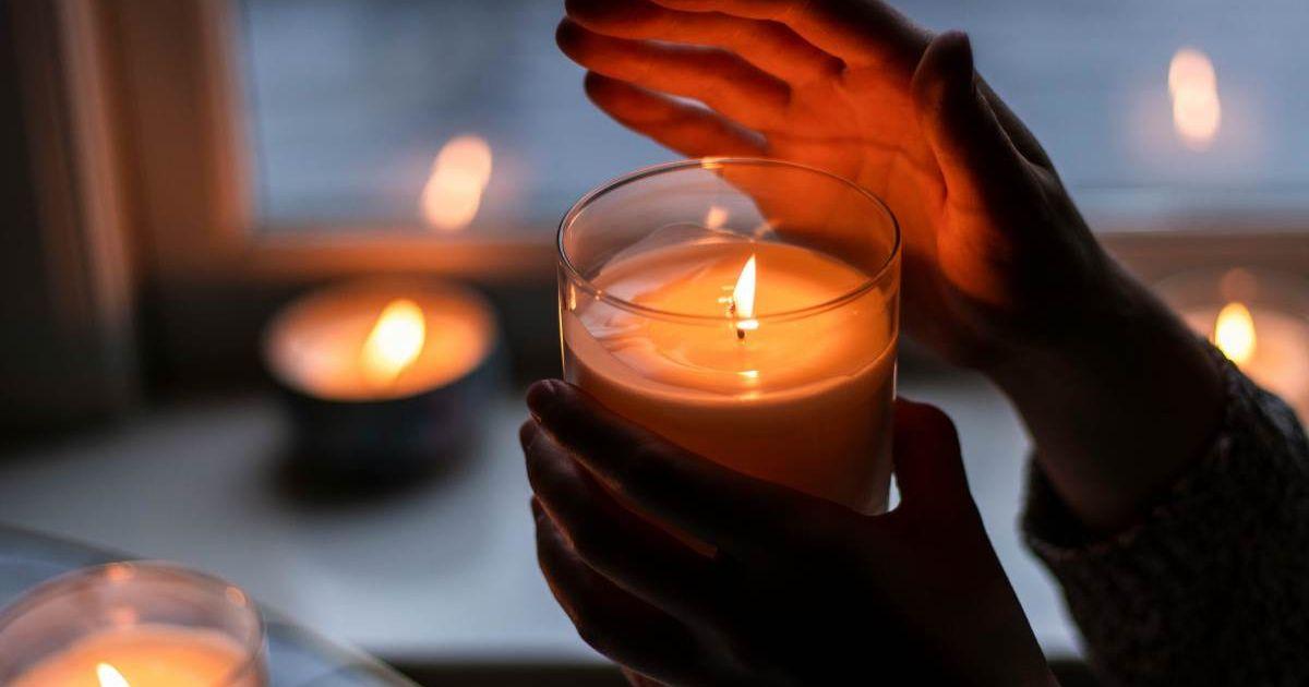 Hand protecting the soft glow of a candle (Representative Cover Image Source: Pexels | The Vibrant Machine)