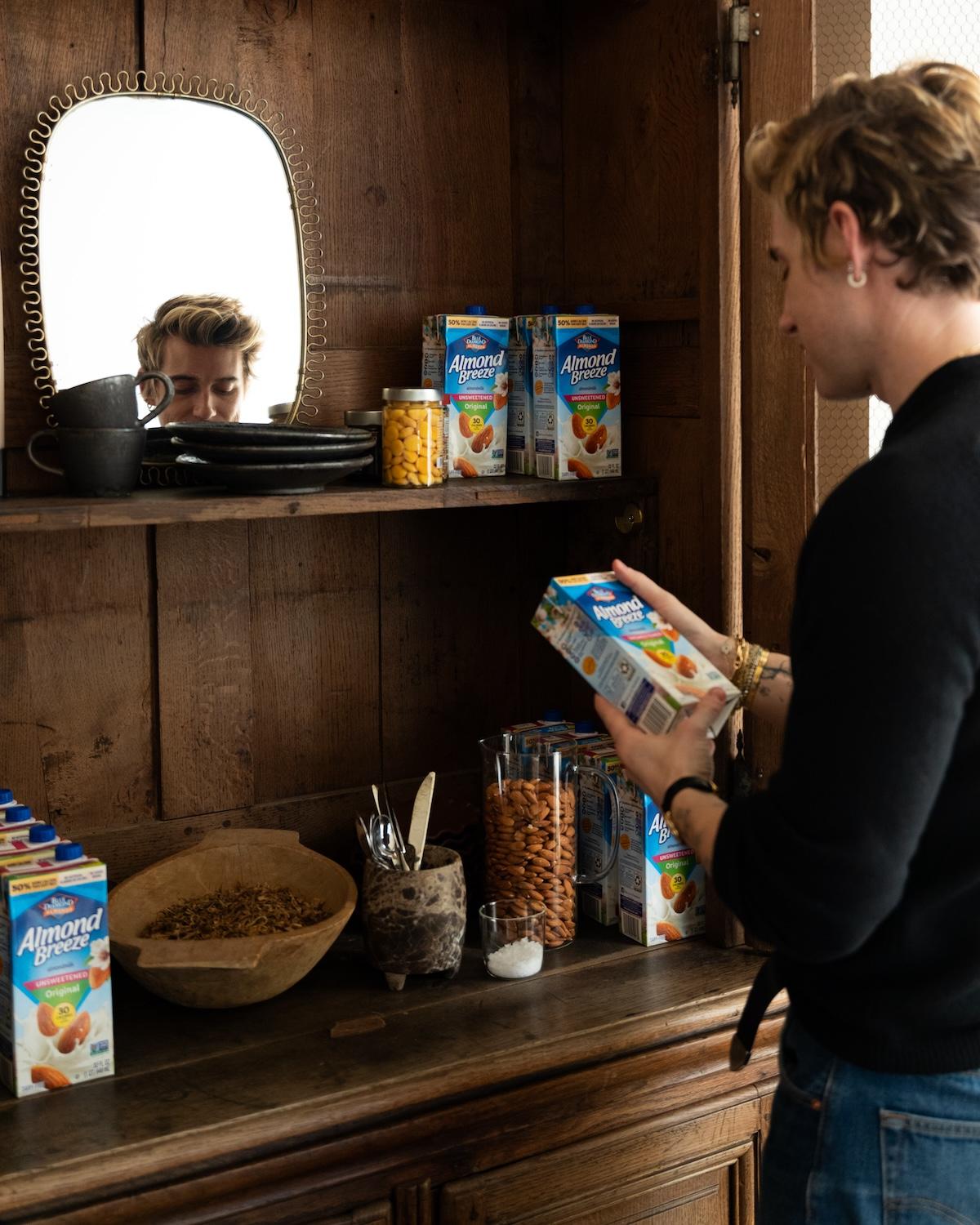 Jeremiah Brent holds a carton of Almond Breeze milk