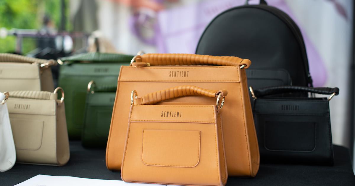 Handbags and backpack by Sentient in assorted colors on a table