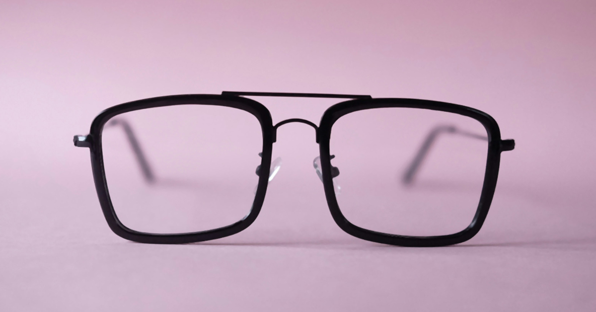A closeup of a pair of black framed glasses