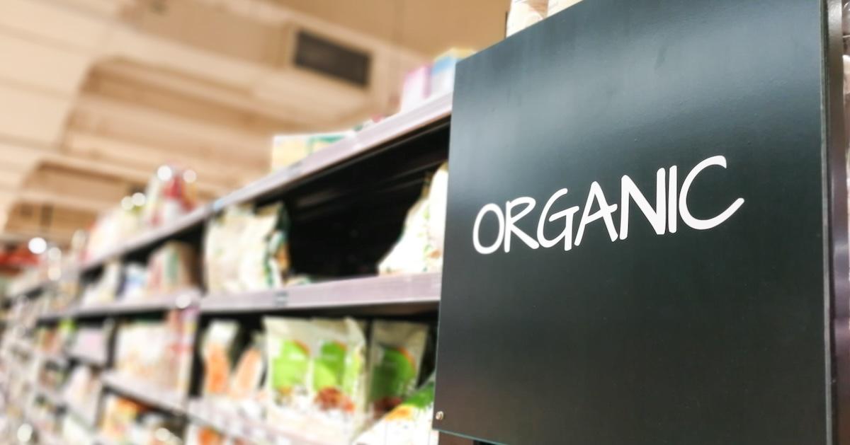 "Organic" sign near grocery aisle at supermarket