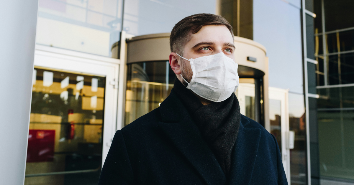 A man wears a facemask to protect himself from illness