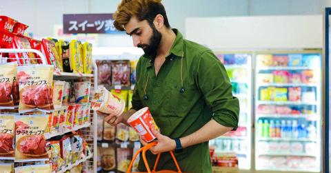 Man checking a product's packaging label while shopping. (Representative Cover Image Source: Pexels | かわい サムライ)